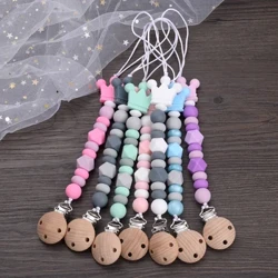 ʻO ka pēpē Silicone e hōʻoluʻolu i ke kaulahao nipple keikikāne kaikamahine hānai Teether Chew nā makana mea pāʻani no ka Anti-Drop Baby Beech Wood Pacifier Chain Clips
