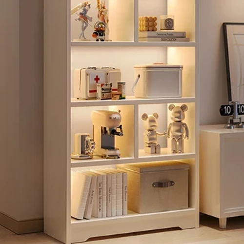Simple toy storage multi-layer corner book cabinet in household living room with articles placed on the floor.