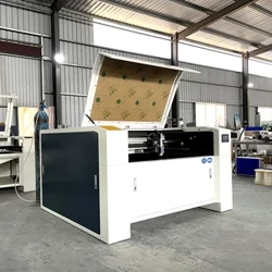 Pinakabago 1390 6090 Wood Co2 Laser Cutting Machine na May Ruida Control At 1300*900mm Working Table 100W Laser Cutter Para sa Metal