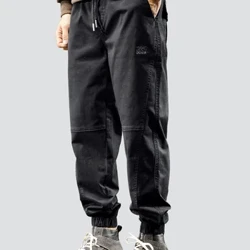 Quần legging nam xuân thu màu đen rộng thùng thình quần âu mùa hè nam có mũ trùm đầu quần tây nam