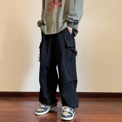 Streetwear 2023 ฤดูใบไม้ผลิ Harem Casual กางเกงผู้ชาย Elastic เอวสีทึบกางเกงหลายกระเป๋าหลวมกางเกงกระโปรงสำหรับสตรี
