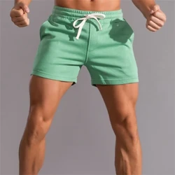 INS Nua Samhraidh na bhFear Sreabhadh Ard-Sráid Trendy Shorts Loose Fóillíocht Spóirt Trasteorann Pants Aclaíochta Dath Soladach Breathable